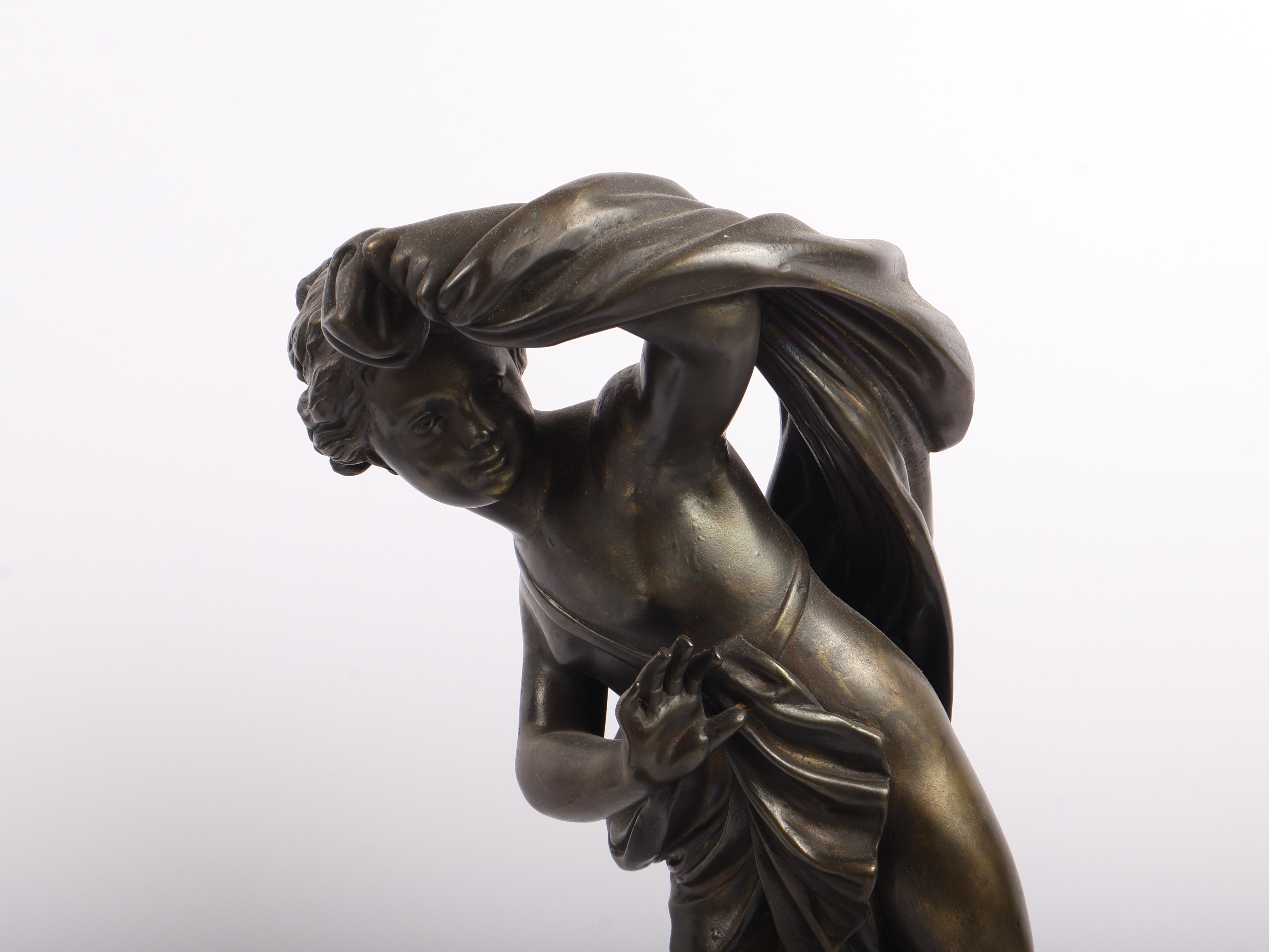 A Pair of Neoclassical Style Patinated Metal Figures of Cherubs on Ebonized Plinths