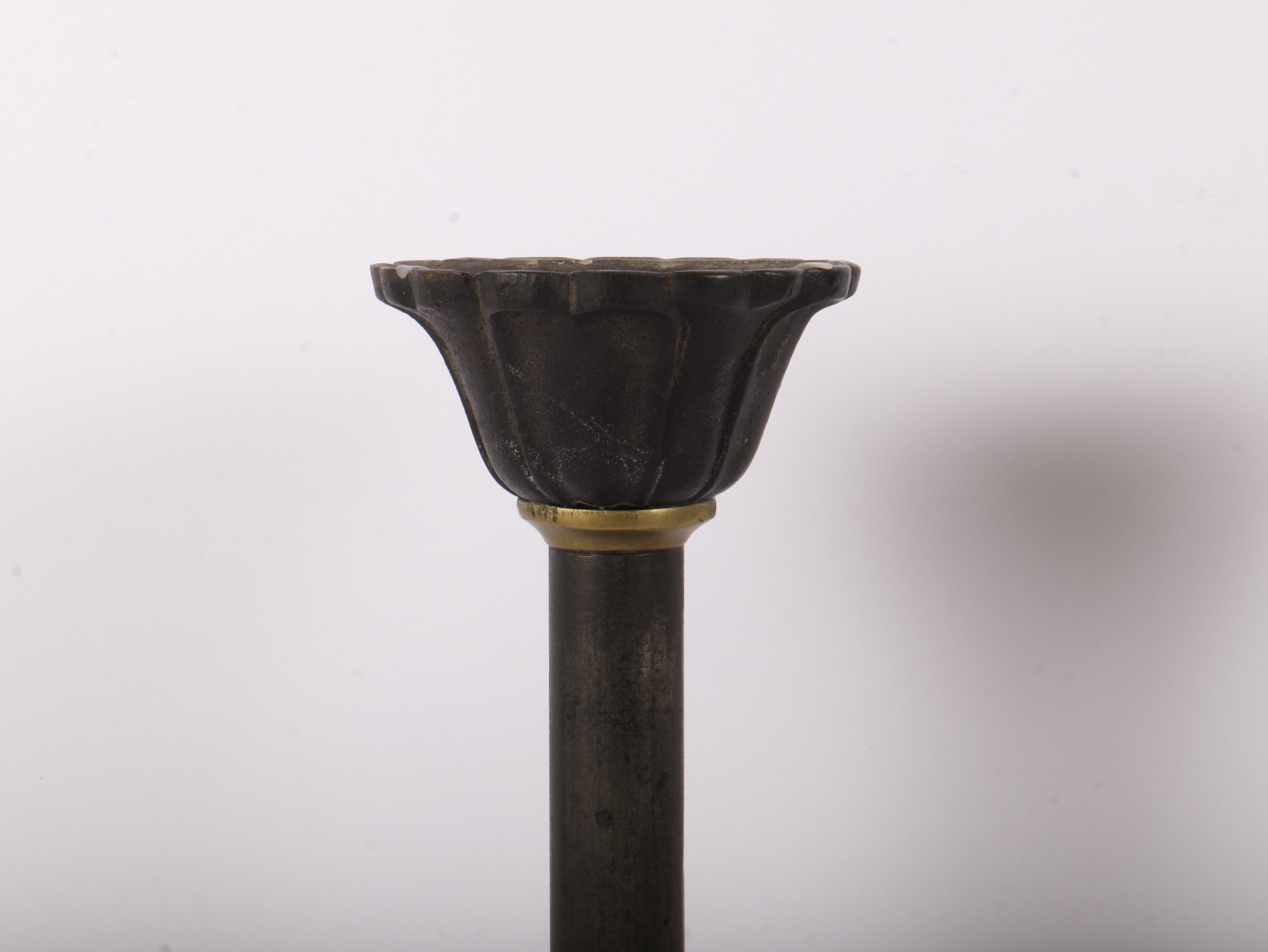 A Pair of Large Late 19th Century Patinated Iron and Turned Brass Candlesticks