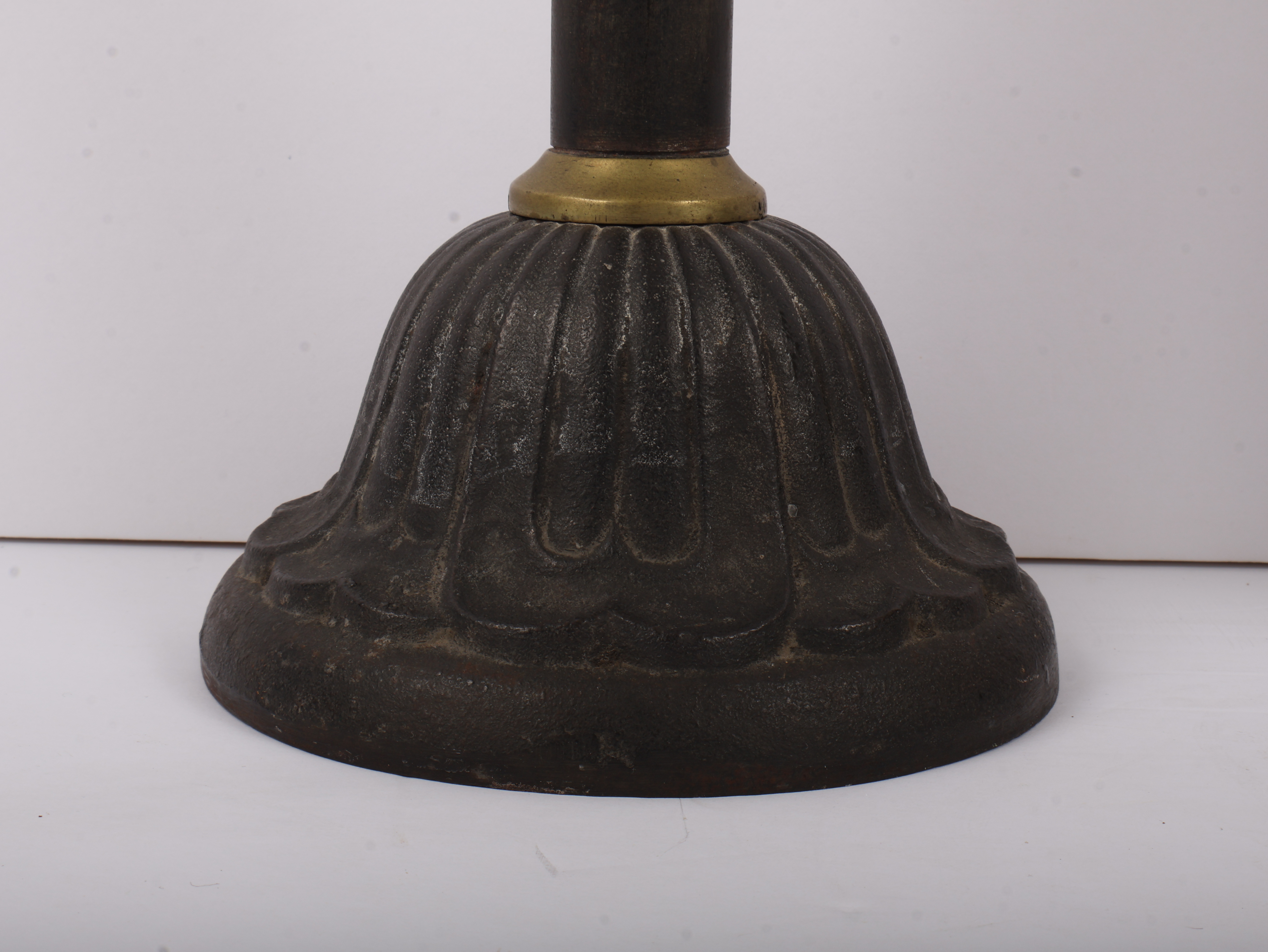 A Pair of Large Late 19th Century Patinated Iron and Turned Brass Candlesticks