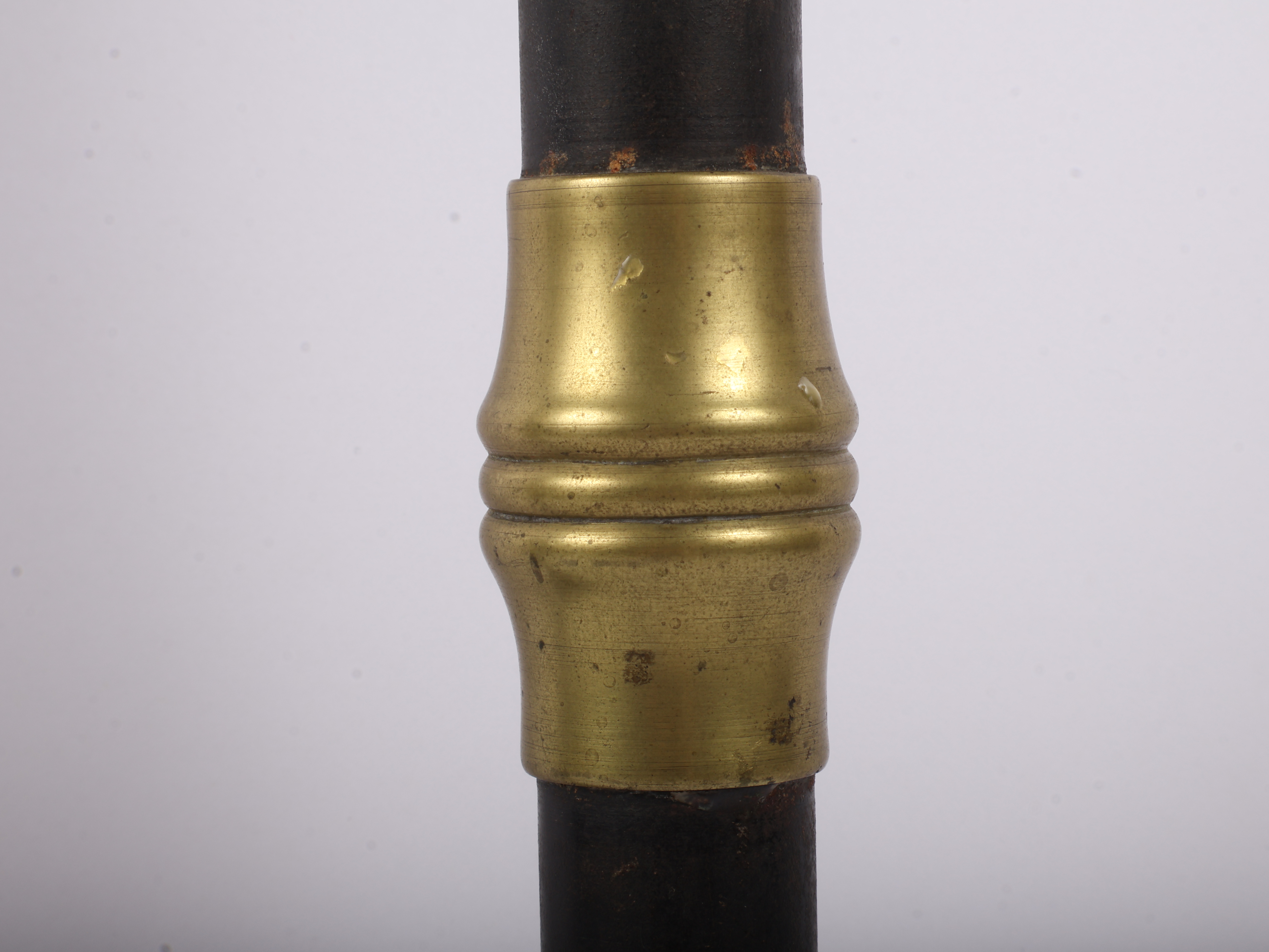 A Pair of Large Late 19th Century Patinated Iron and Turned Brass Candlesticks