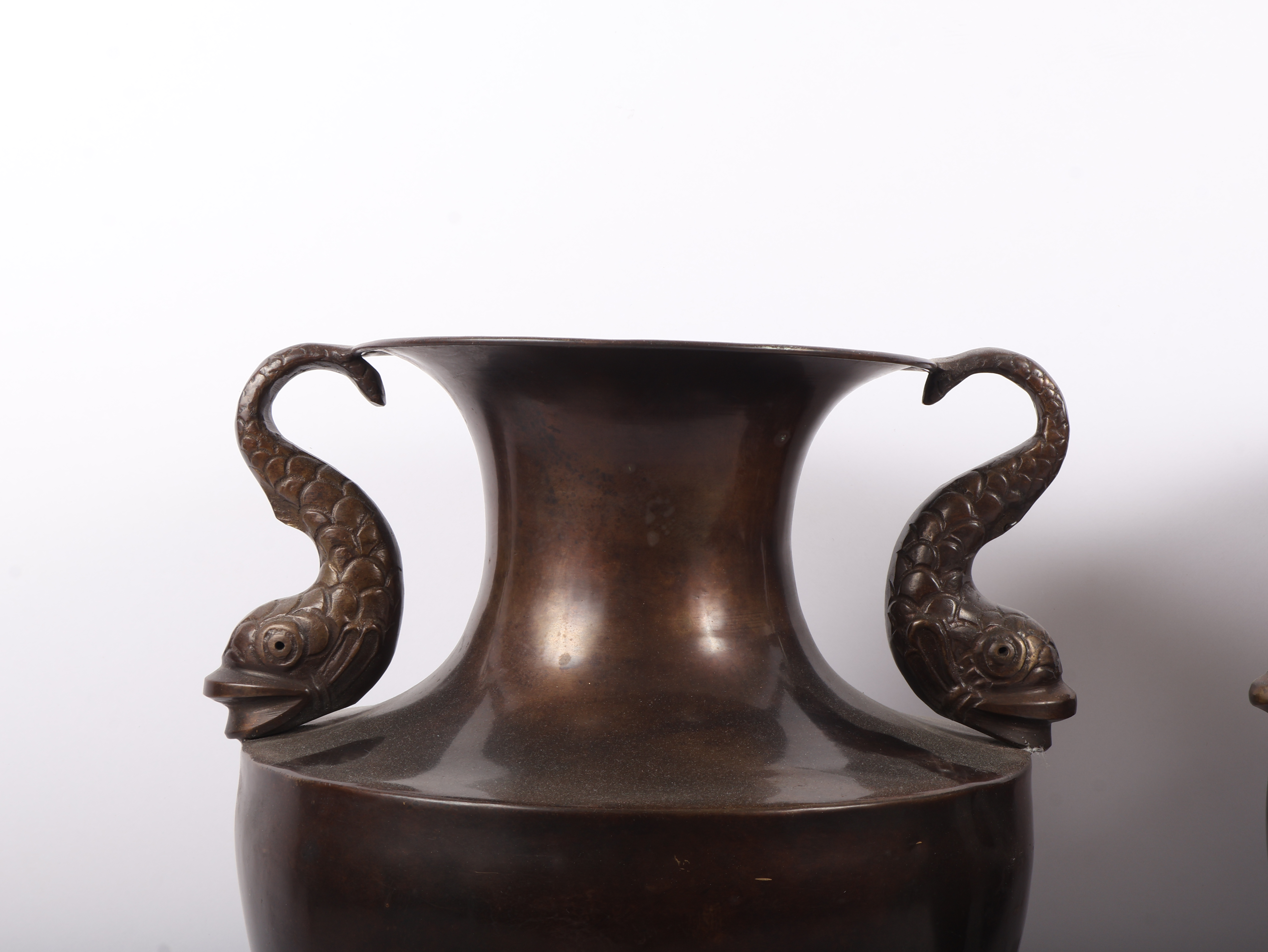 A Pair of Neoclassical Style Brass Urns with Dolphin Handles