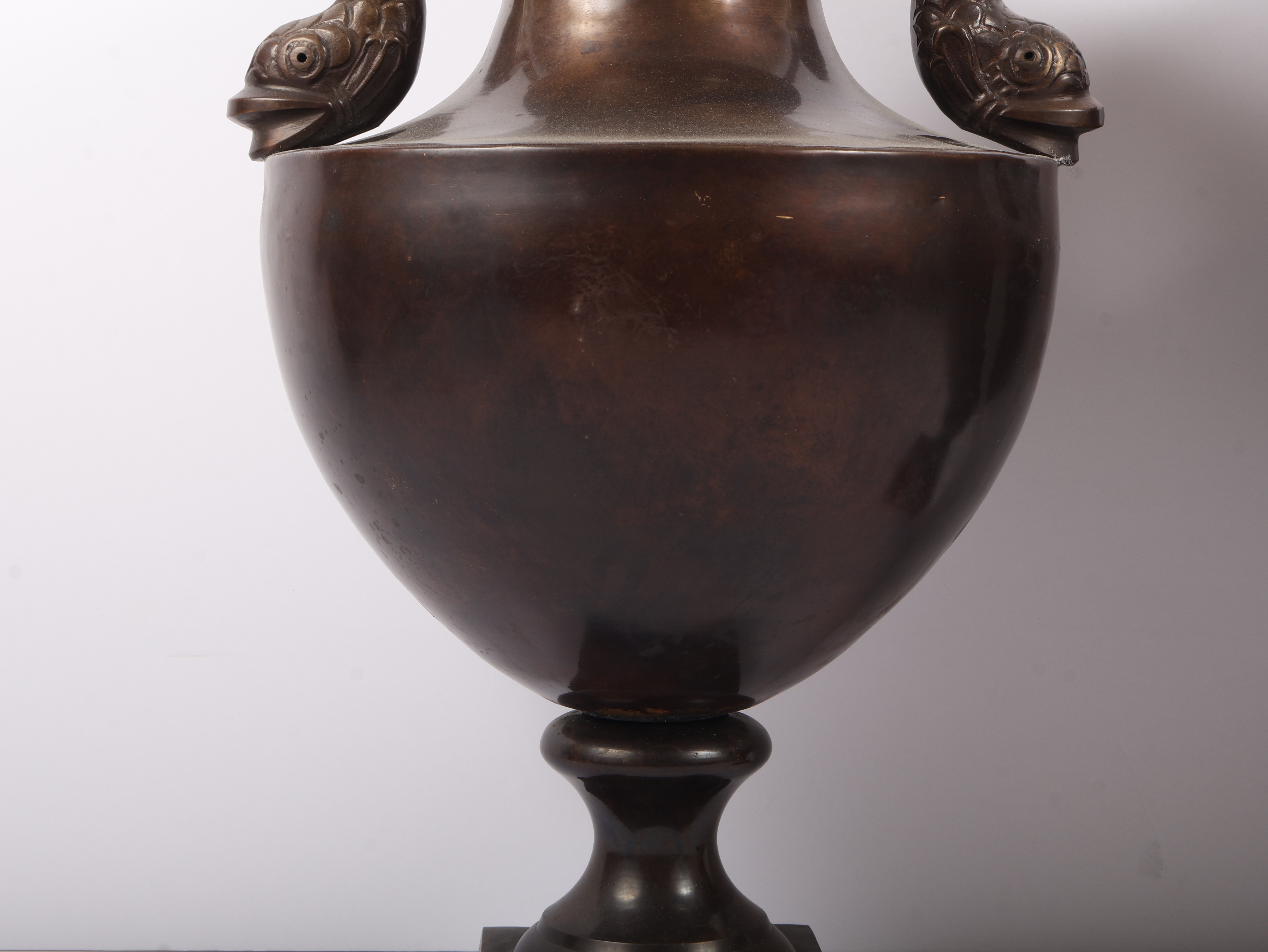 A Pair of Neoclassical Style Brass Urns with Dolphin Handles