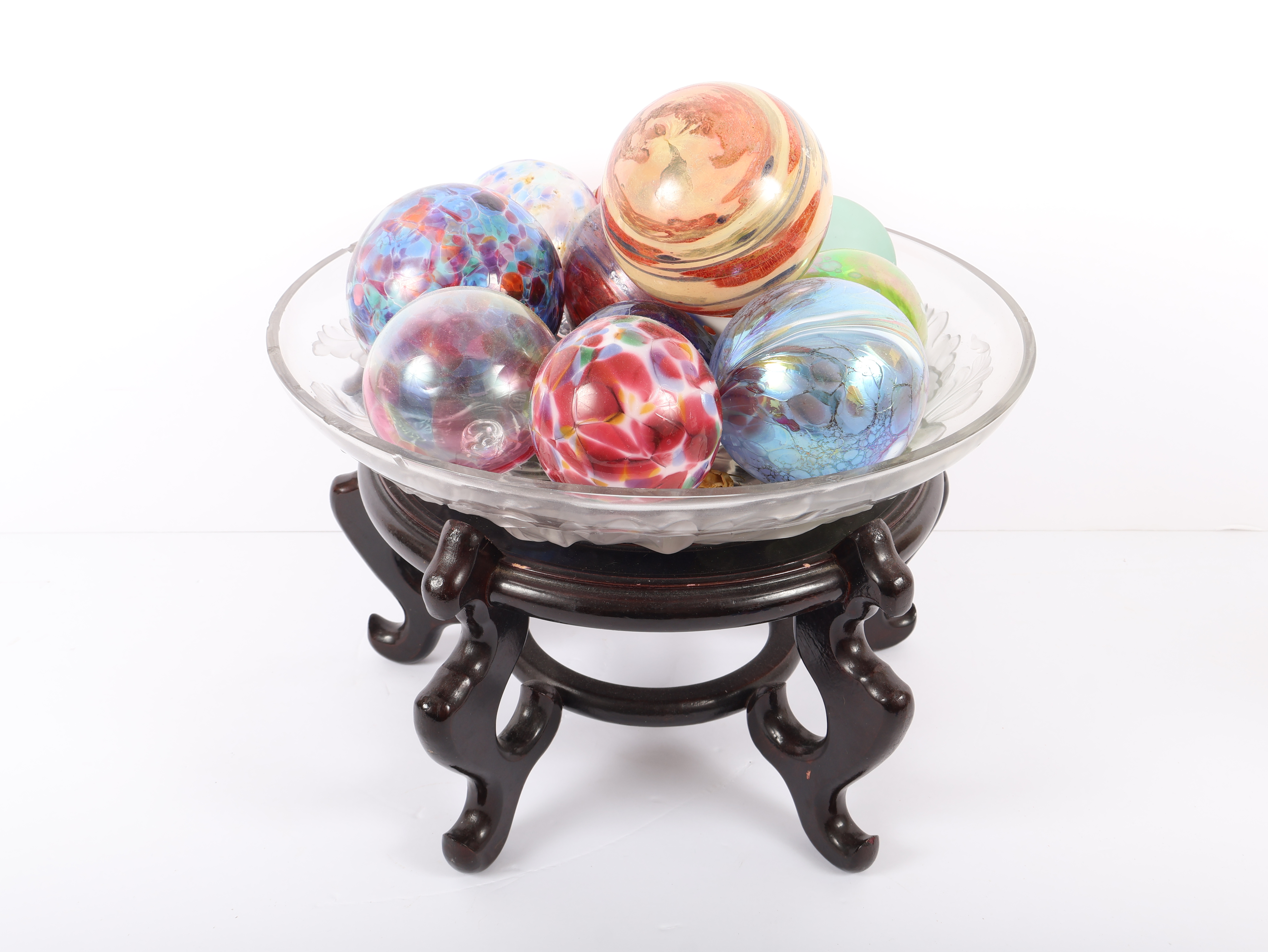 An Assortment of Eleven Blown Art Glass Spheres in a Frosted Glass Bowl on an Oriental Rosewood Stand