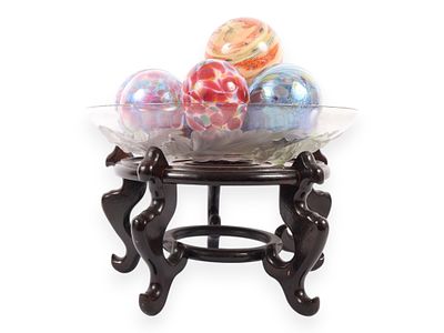An Assortment of Eleven Blown Art Glass Spheres in a Frosted Glass Bowl on an Oriental Rosewood 