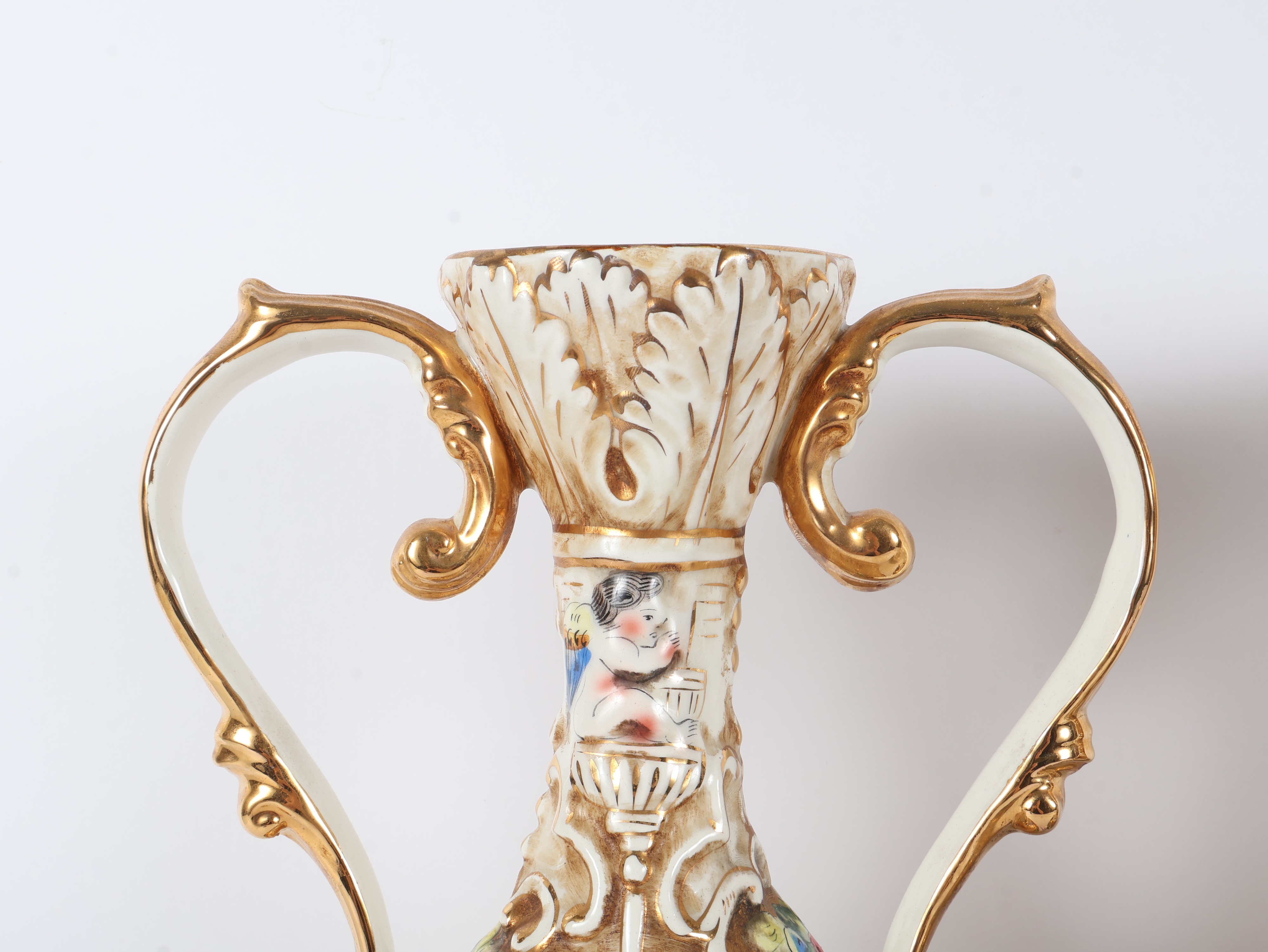 A Pair of Capodimonte Polychrome and Gilded Two-Handle Porcelain Vases