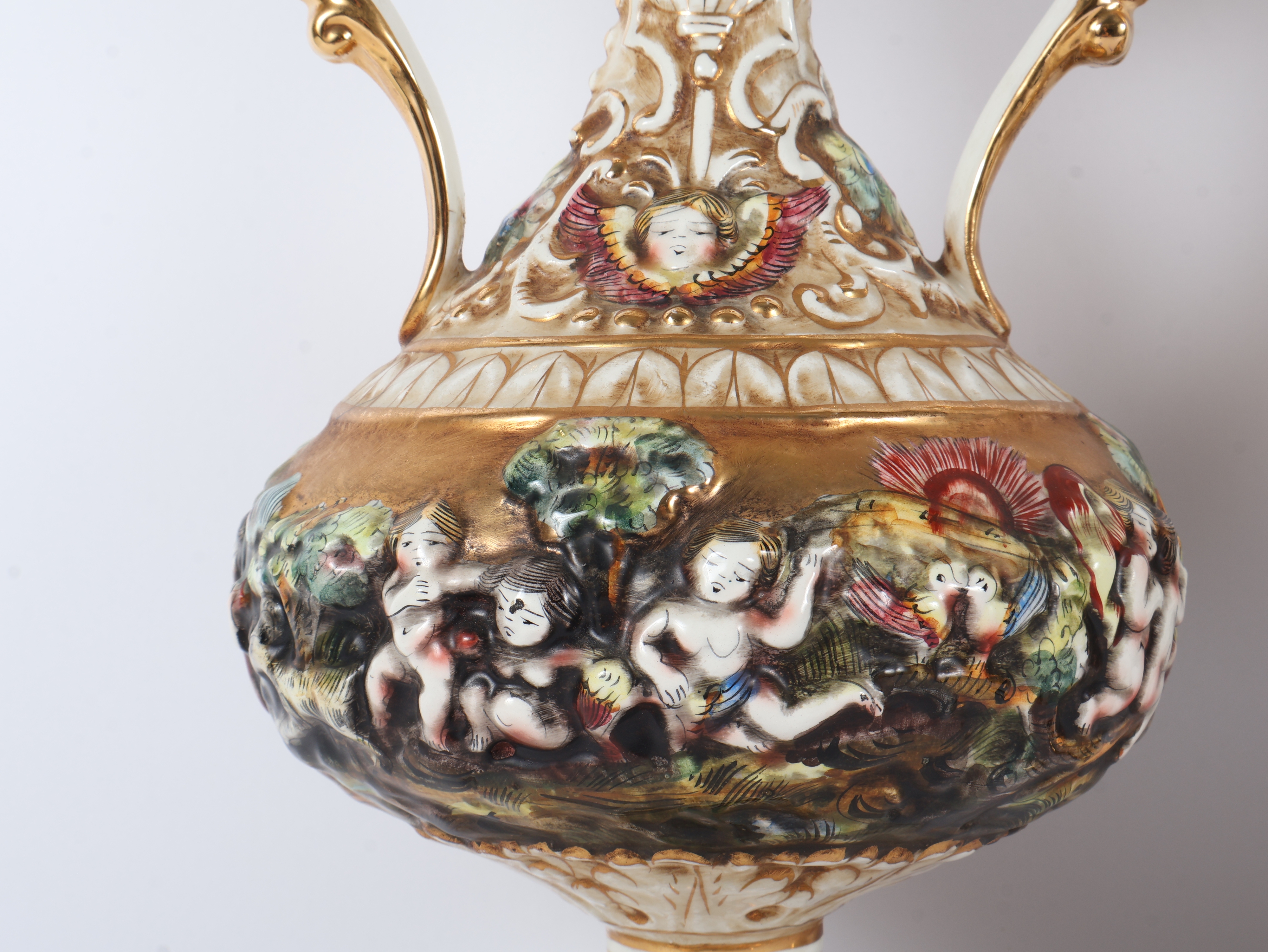 A Pair of Capodimonte Polychrome and Gilded Two-Handle Porcelain Vases