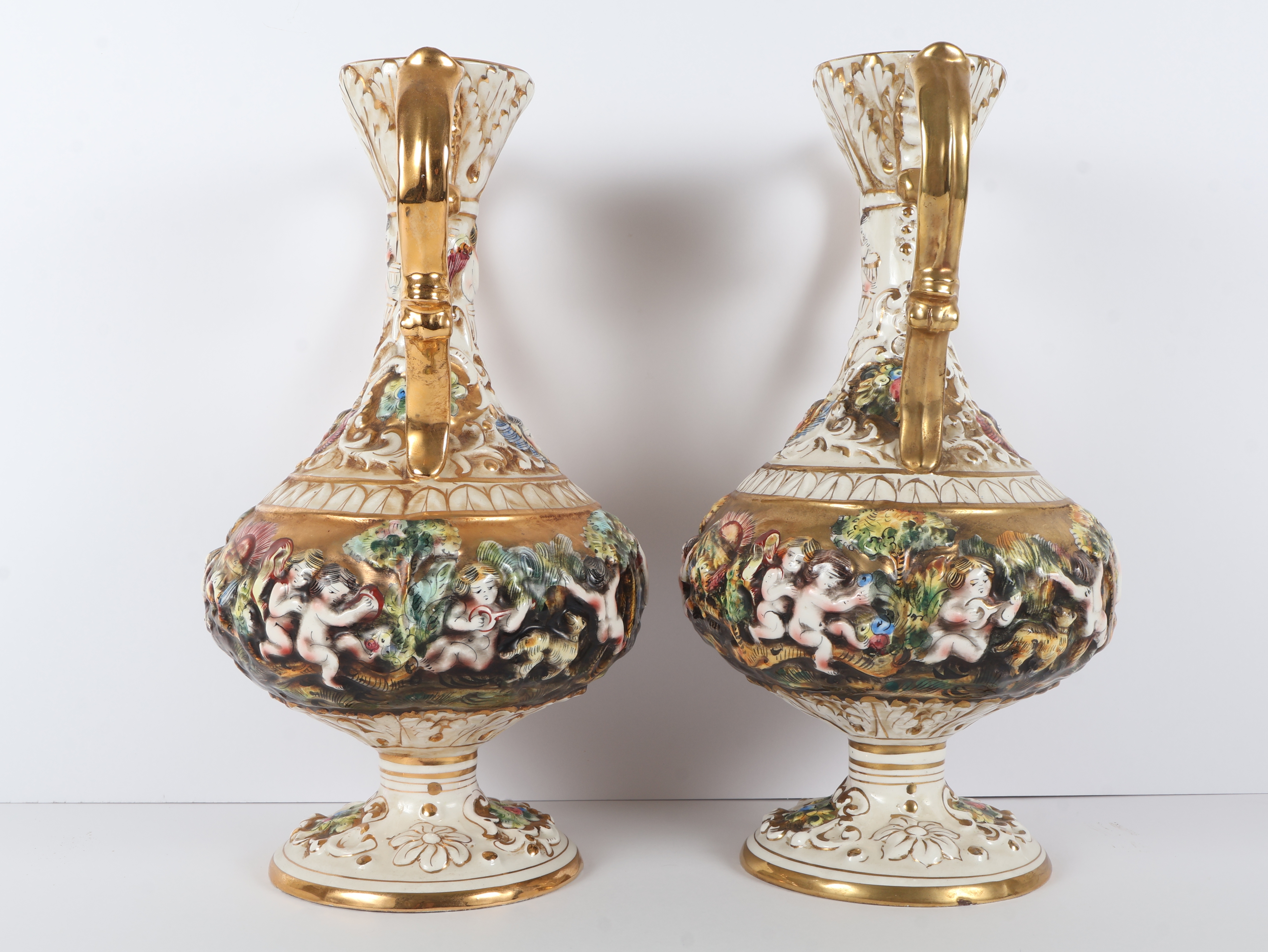 A Pair of Capodimonte Polychrome and Gilded Two-Handle Porcelain Vases