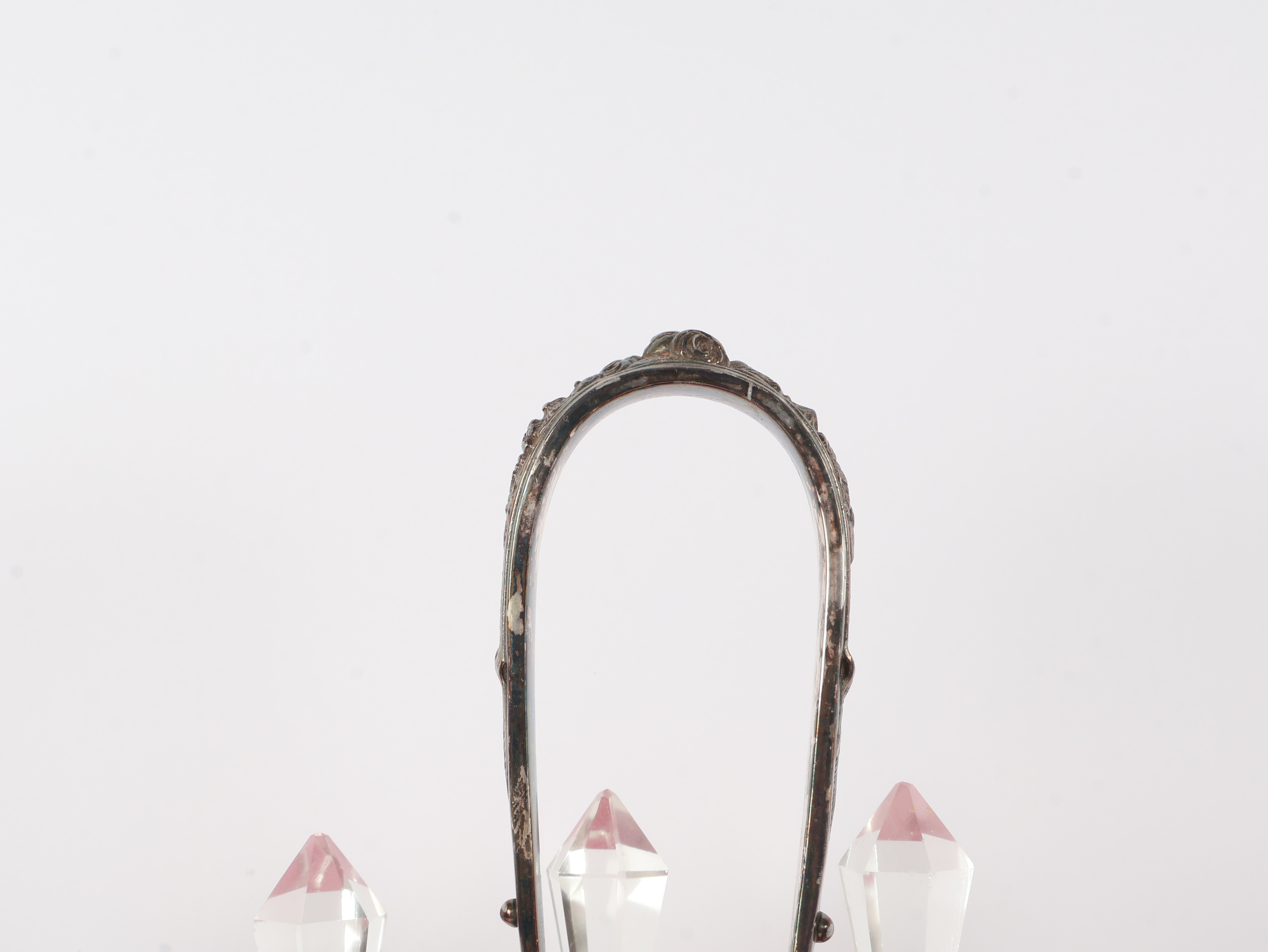 A Set of Five Victorian Cranberry Glass Bottles in an Ornate Silver-Plated Caster Stand