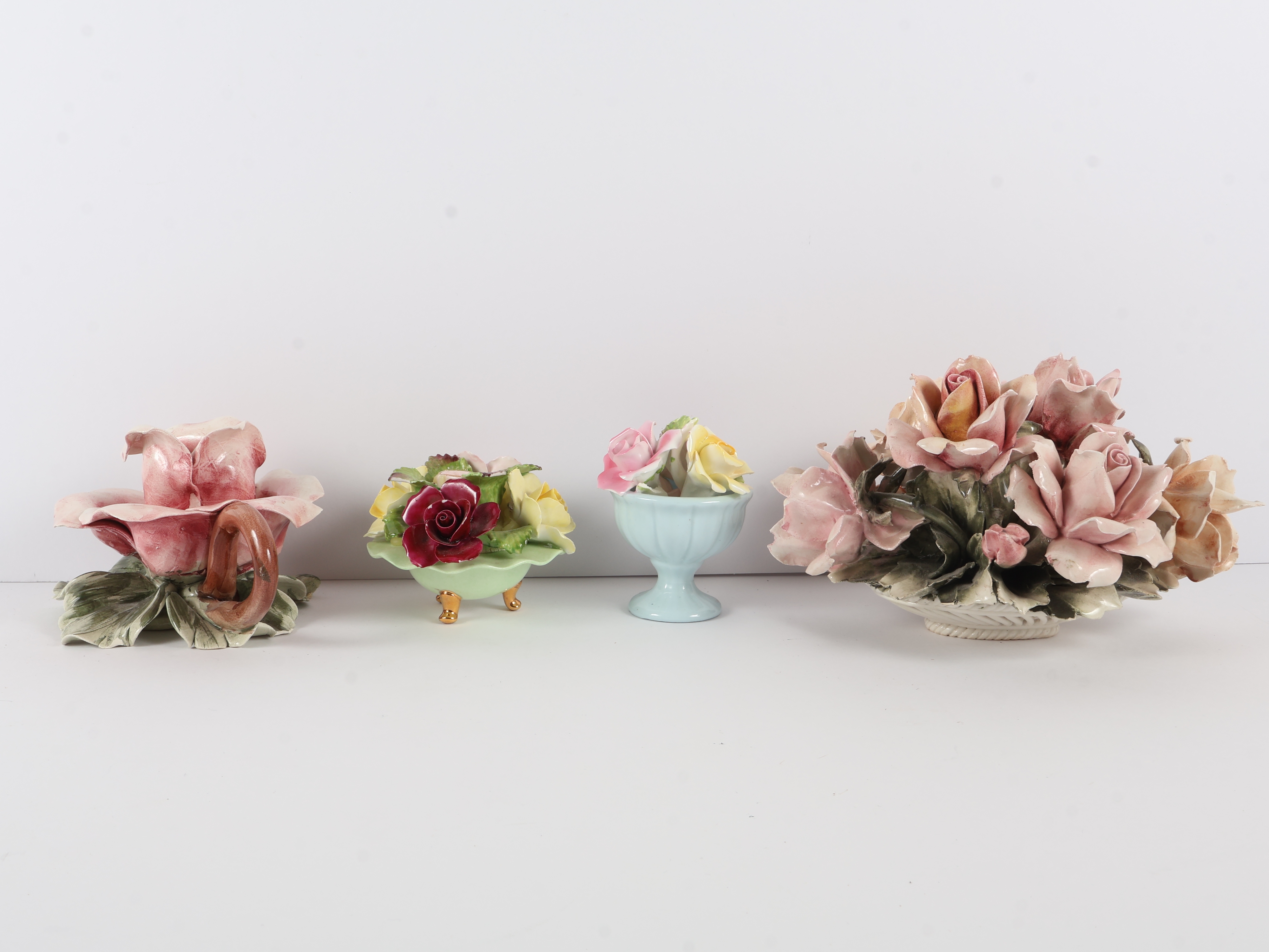 A Collection of Four English and Italian Ceramic Floral Ornaments including Denton, Thorley, and Nora Fashion