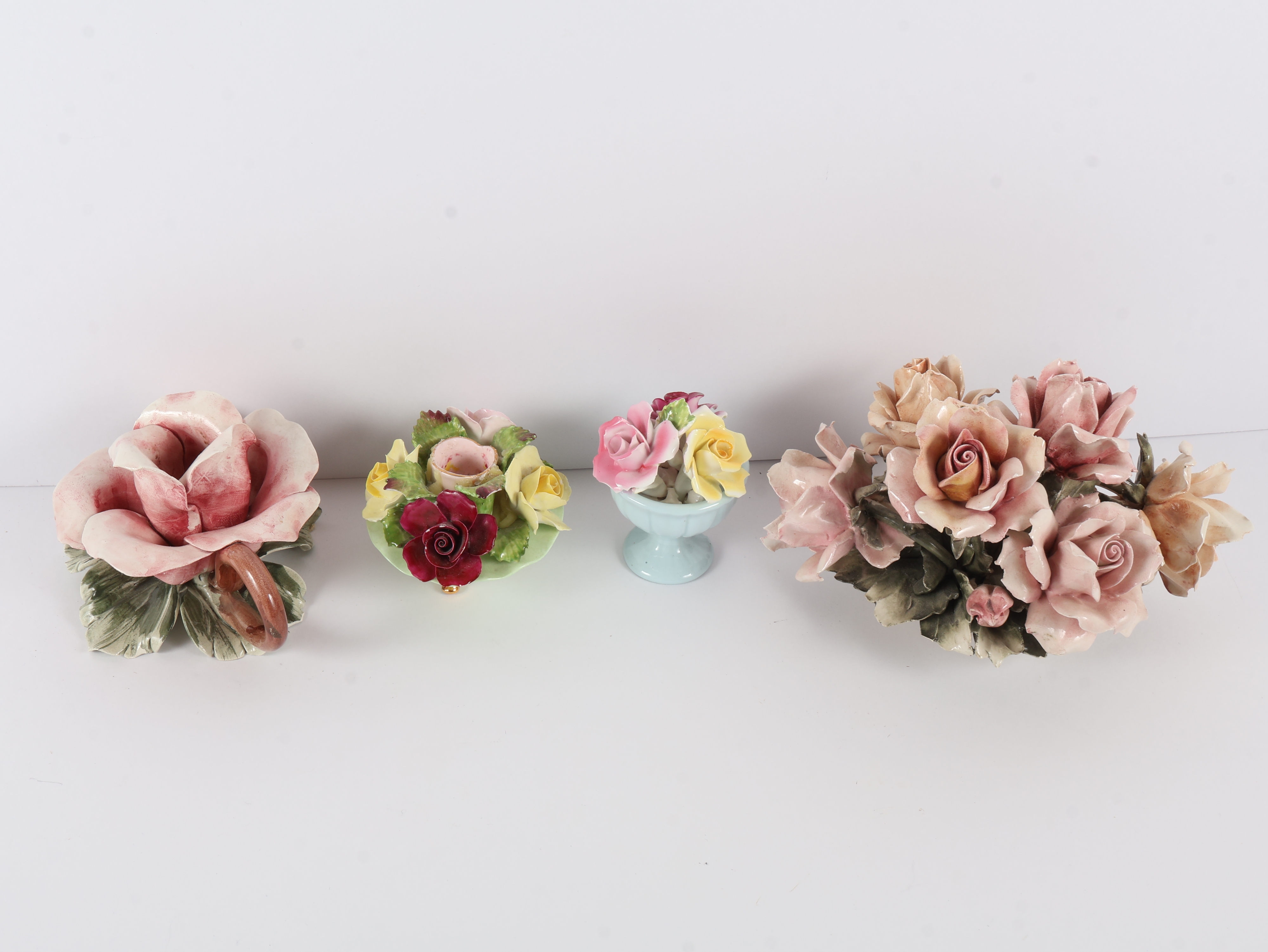 A Collection of Four English and Italian Ceramic Floral Ornaments including Denton, Thorley, and Nora Fashion