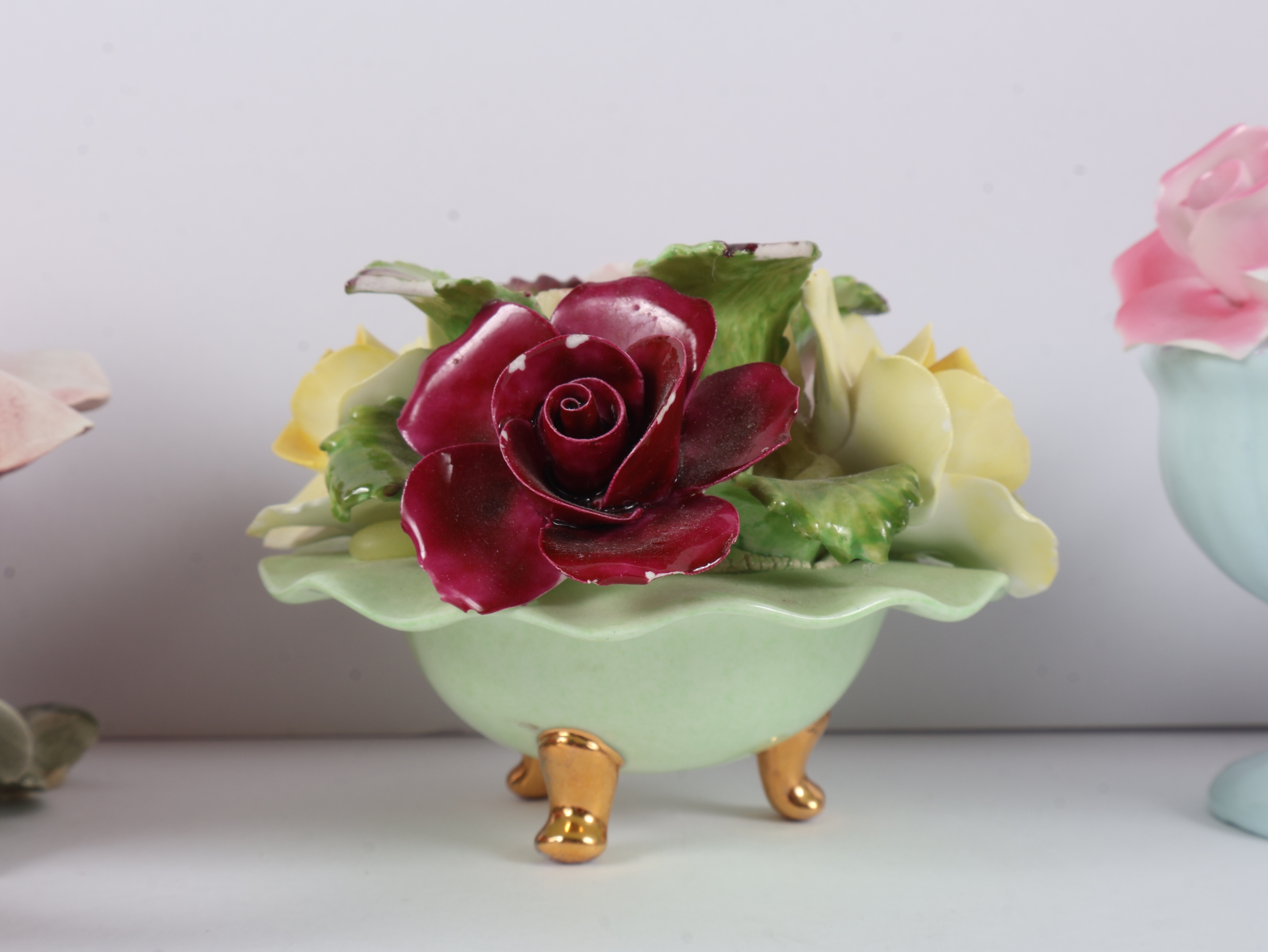 A Collection of Four English and Italian Ceramic Floral Ornaments including Denton, Thorley, and Nora Fashion