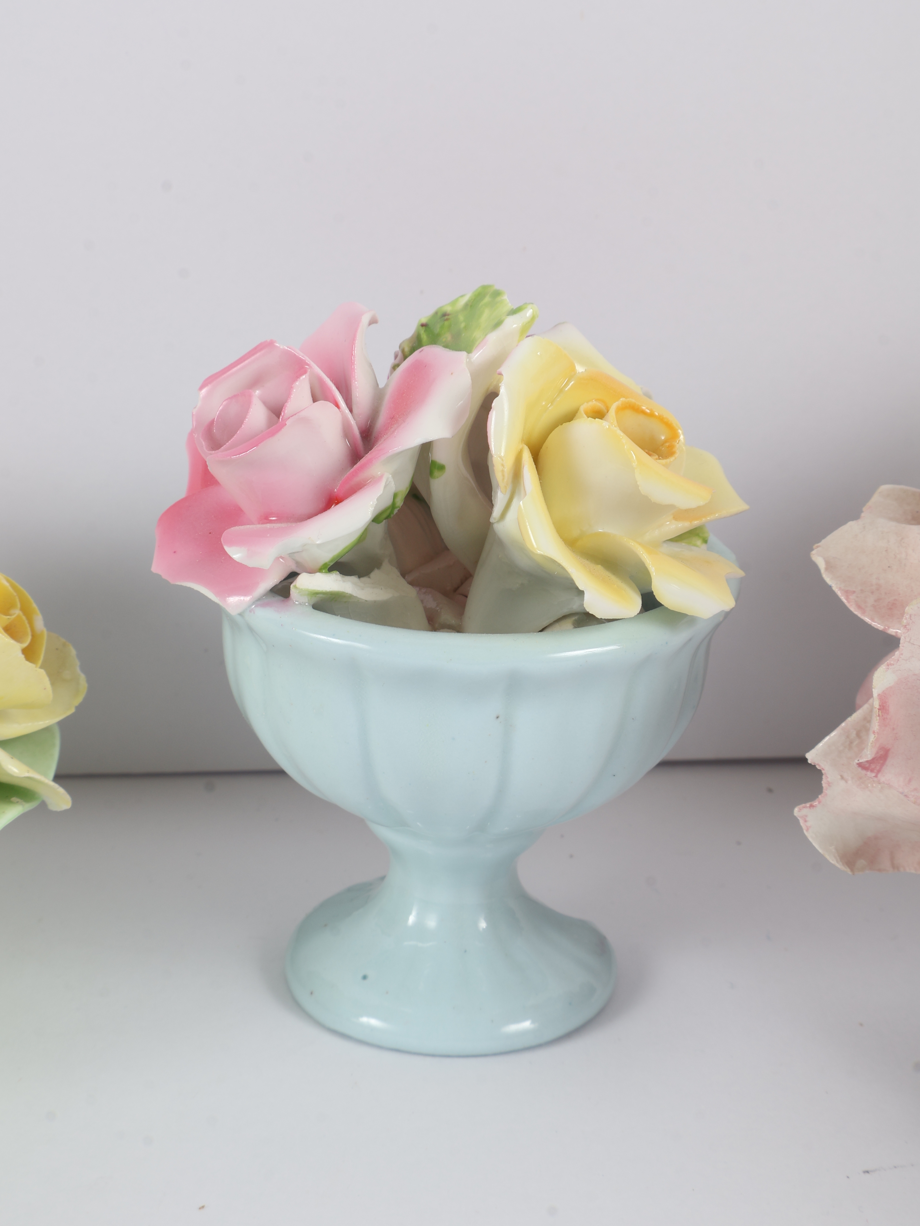 A Collection of Four English and Italian Ceramic Floral Ornaments including Denton, Thorley, and Nora Fashion