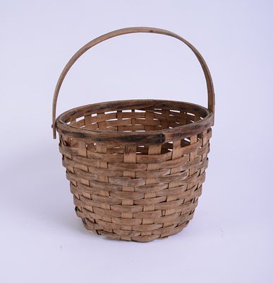 New England Woven Basket. Height 9 inches. Some breaks at base.