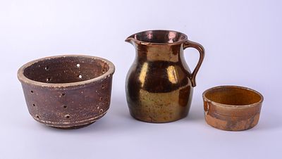 Small Redware Pitcher and Two Collanders. Height of pitcher 5.5 inches. Pitcher in good 