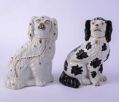 Two Staffordshire Dogs. Heights 10.5 and 10.75 inches. Both in good condition.