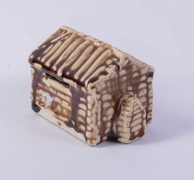 Van Dyk Porcelain Log Cabin Bank. Where Abraham Lincoln was born, length 4 inches, good condition.