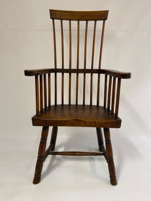 A stunning and large primitive comb back Welsh oak stick chair, dating 1760-1780. It is in 