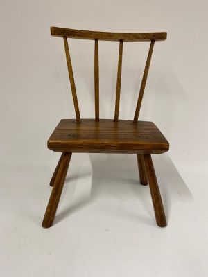A 19th century primitive pine and oak Childs stick chair