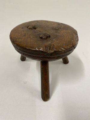 A very special 18th century Welsh oak milking stool with turned seat, a wonderfully charming 