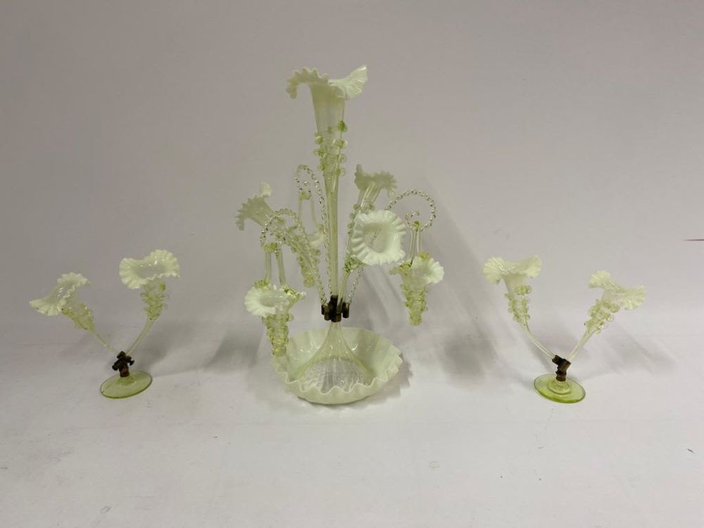 A large 19th century possibly uranium glass epergne 
There is a break in the base of one of the 
