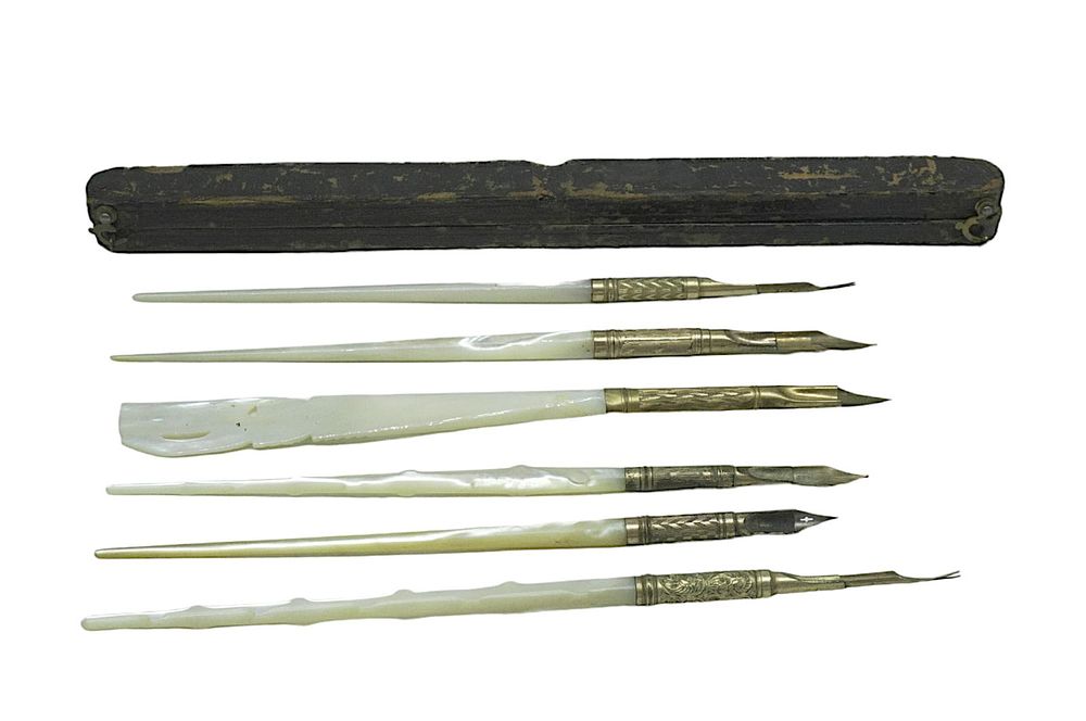 Lot 244: ANTIQUE MOTHER OF PEARL INK QUILLS AND CASE - 7 PIECES