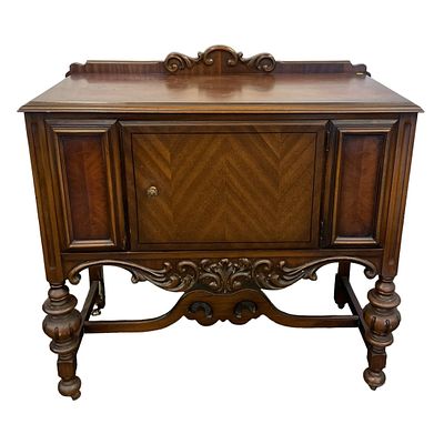 ANTIQUE AMERICAN WALNUT SIDEBOARD. Antique American walnut sideboard.c. 1920s. Carved scroll 