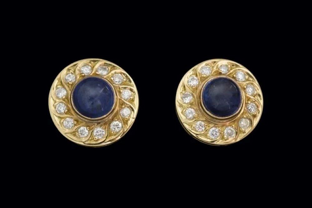 Lot 121: 18k SAPPHIRE CABOCHON AND DIAMOND PIERCED EARRINGS