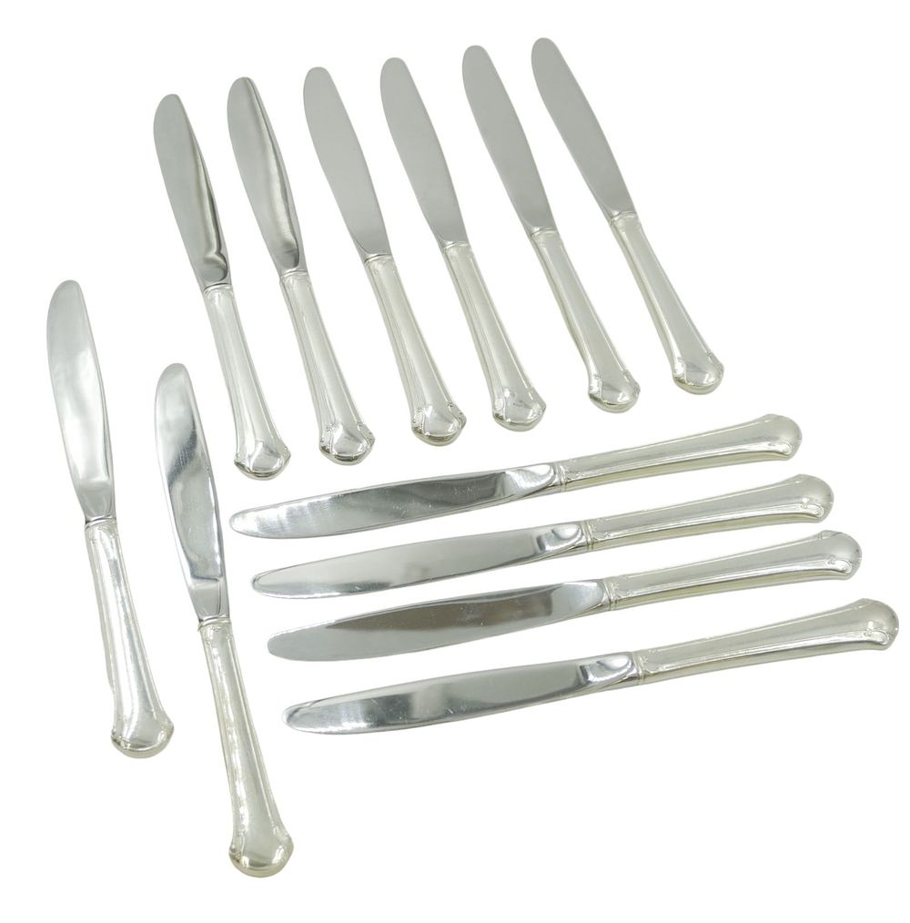 Lot 183: 12 STERLING SILVER CHIPPENDALE DINNER KNIVES