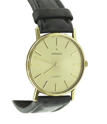 MOVADO 14K MENS DRESS WATCH. Movado 14k yellow gold mens dress watch with leather band featuring 