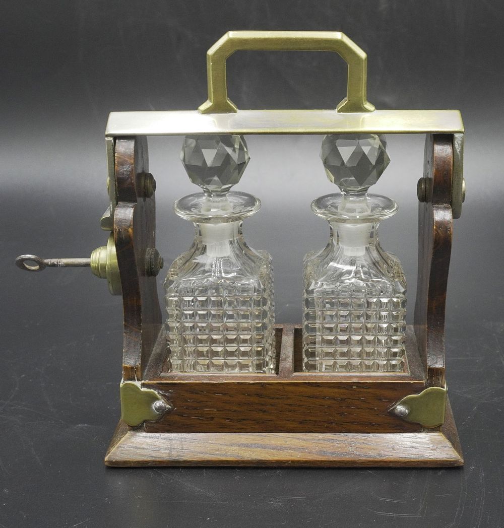 Lot 70: LATE 19TH CENTURY VICTORIAN OAK AND CRYSTAL TANTALUS