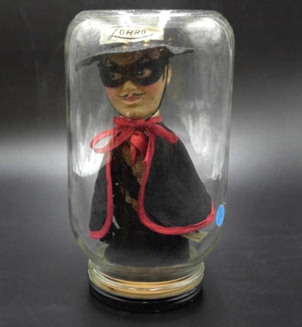 Lot 89: VINTAGE ZORRO GUND HAND PUPPET IN A JAR