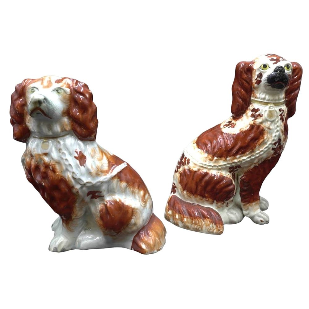 Lot 293: PAIR OF STAFFORDSHIRE KING CHARLES SPANIEL DOG FIGURINES