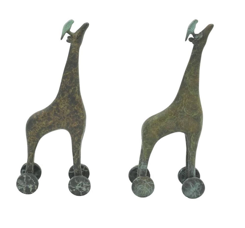 Lot 168: PAIR BRONZE GIRAFFES ON WHEELS WITH PARROTS