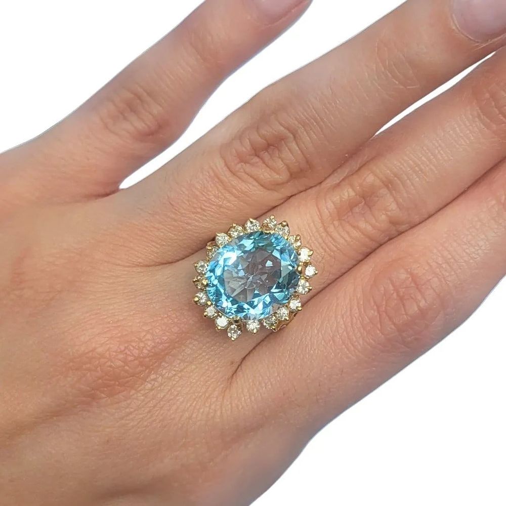 Lot 144: LADIES 14k BLUE TOPAZ AND DIAMOND RING SIZE 7 1/4