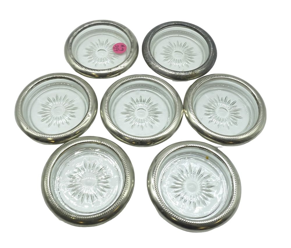 Lot 249: 7 STERLING SILVER RIMMED COASTERS