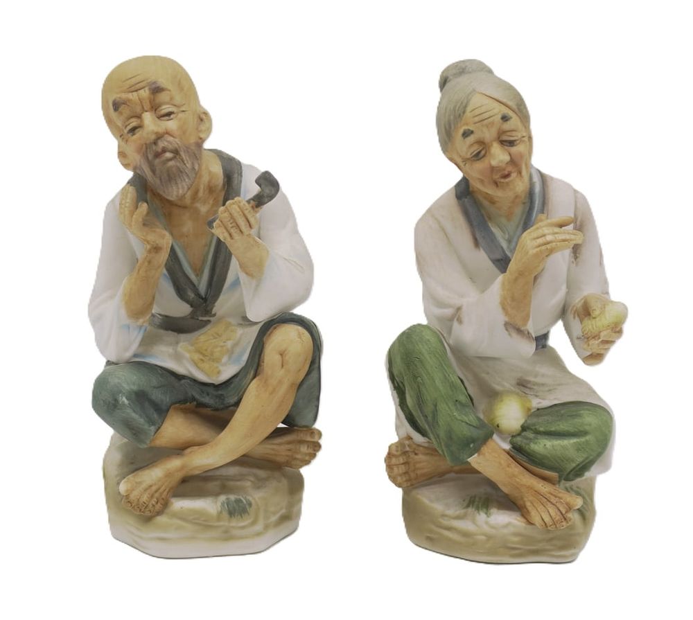 Lot 344: JAPANESE BISQUE PORCELAIN OLD MAN AND WOMAN FIGURINES