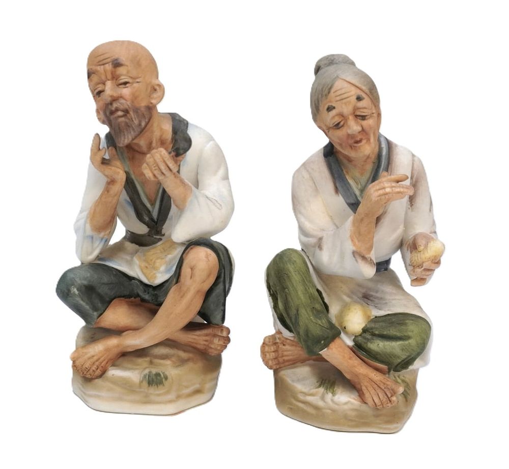 Lot 344: JAPANESE BISQUE PORCELAIN OLD MAN AND WOMAN FIGURINES