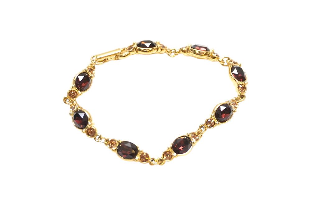 Lot 284: SWAROVSKI CRYSTAL RUBY & TOPAZ BRACELET