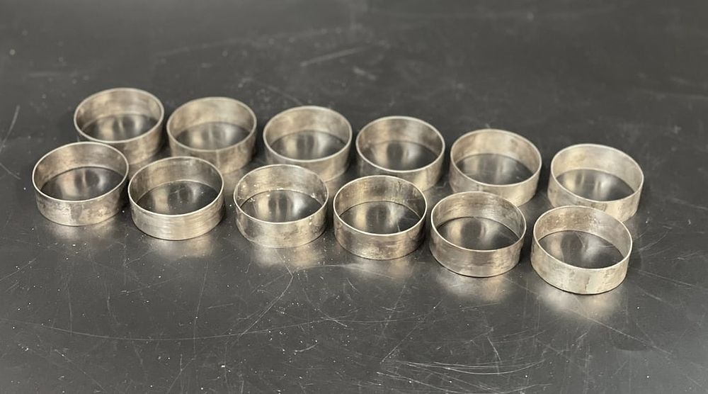 Lot 276: 12 SILVER NAPKIN RINGS ST LOUIS SCHOOL BAGUIO CITY