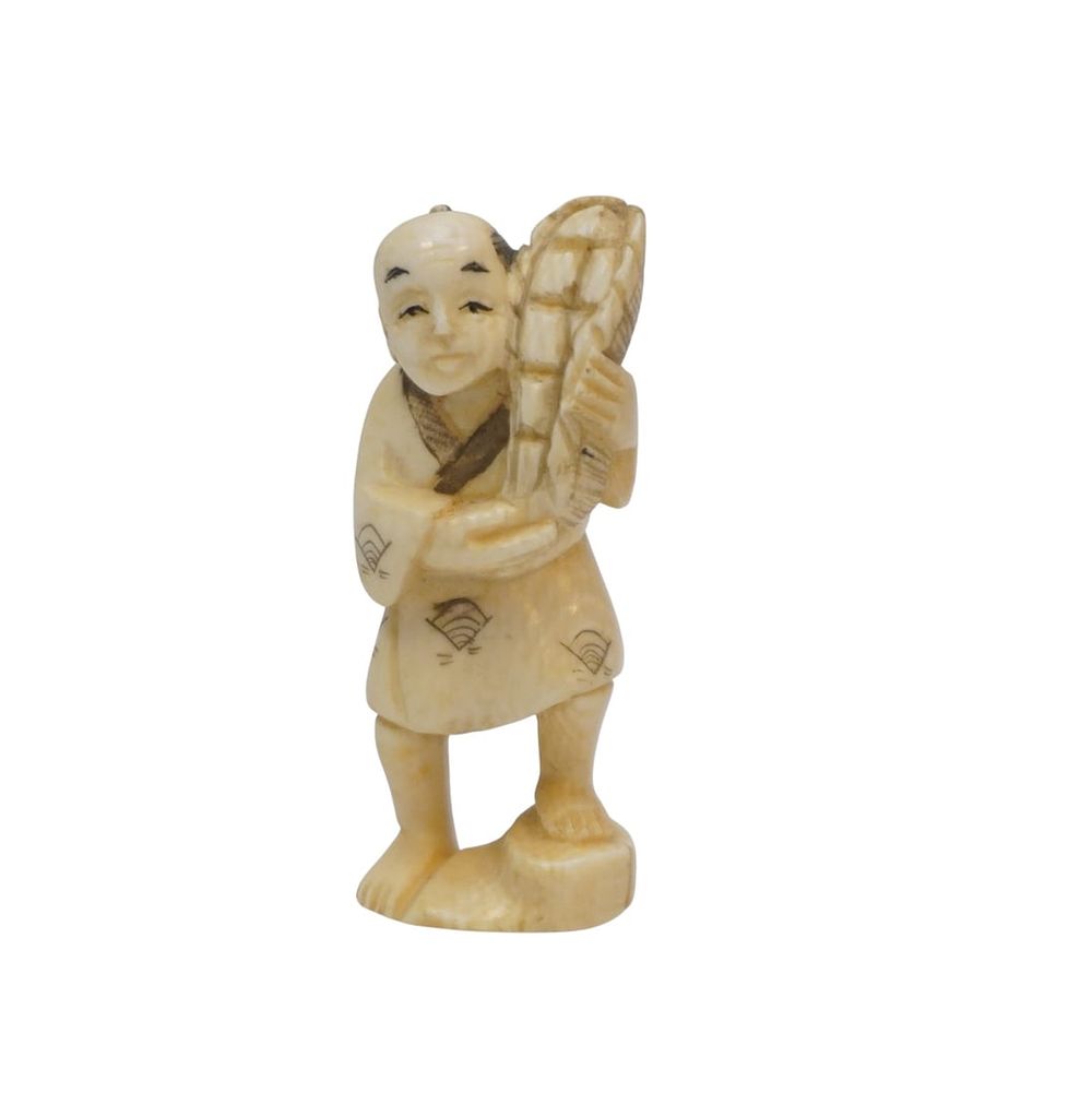 Lot 196: JAPANESE OKIMONO MAN WITH BASKET