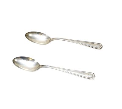 2 ANTIQUE STERLING SILVER SPOONS. 2 Antique Sterling Silver Teaspoons, monogrammed. Each 5 3/4". 