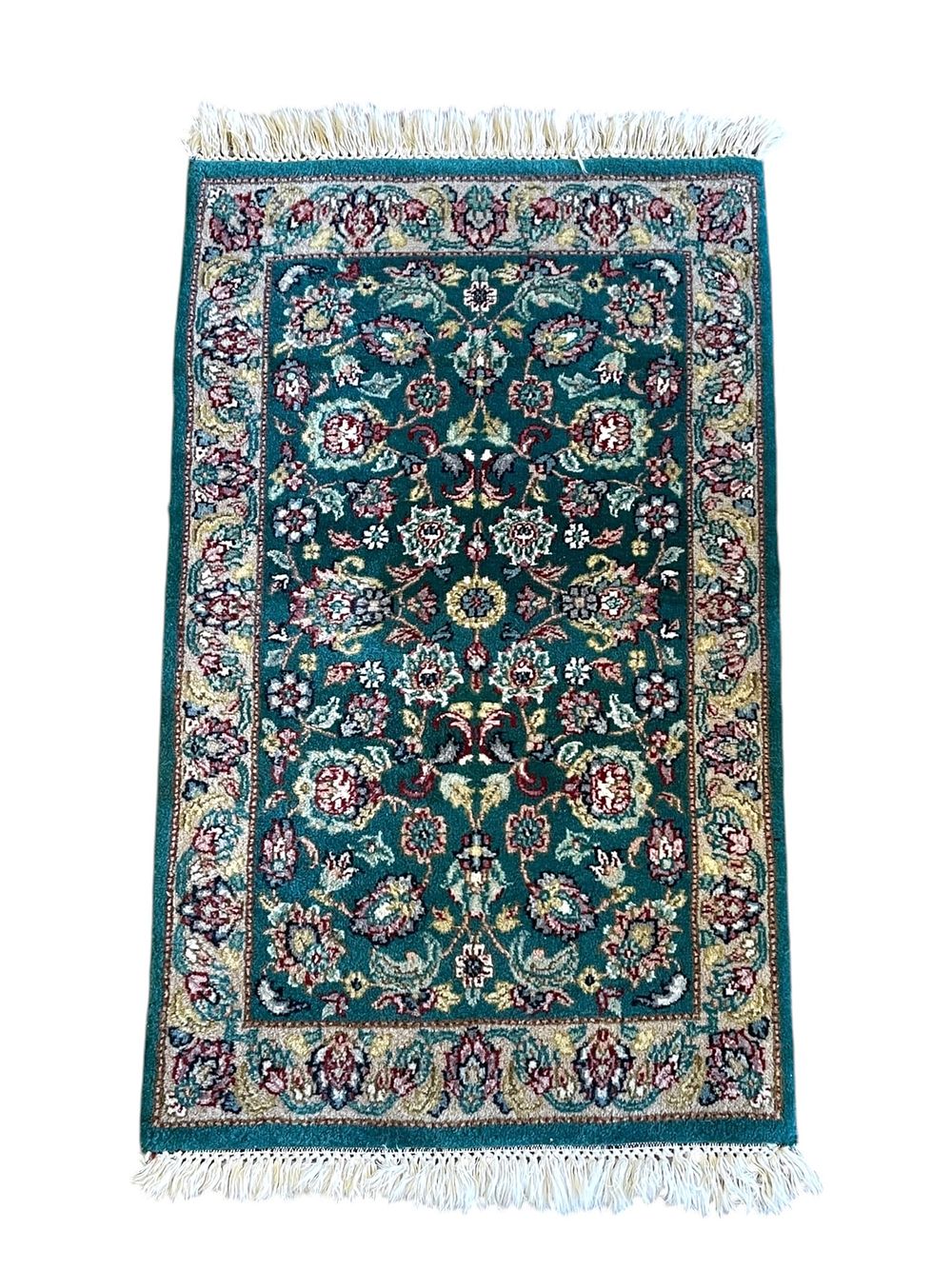 Lot 167: SMALL GREEN HAND KNOTTED TABRIZ RUG