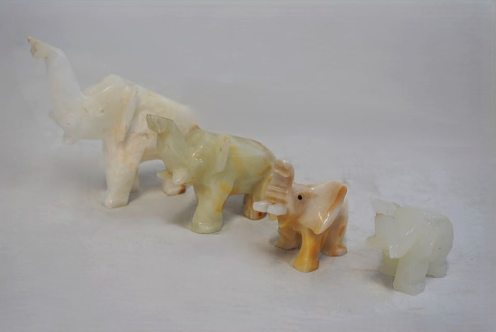 Lot 217: 4 WHITE MARBLE AND ONYX CARVED ELEPHANTS