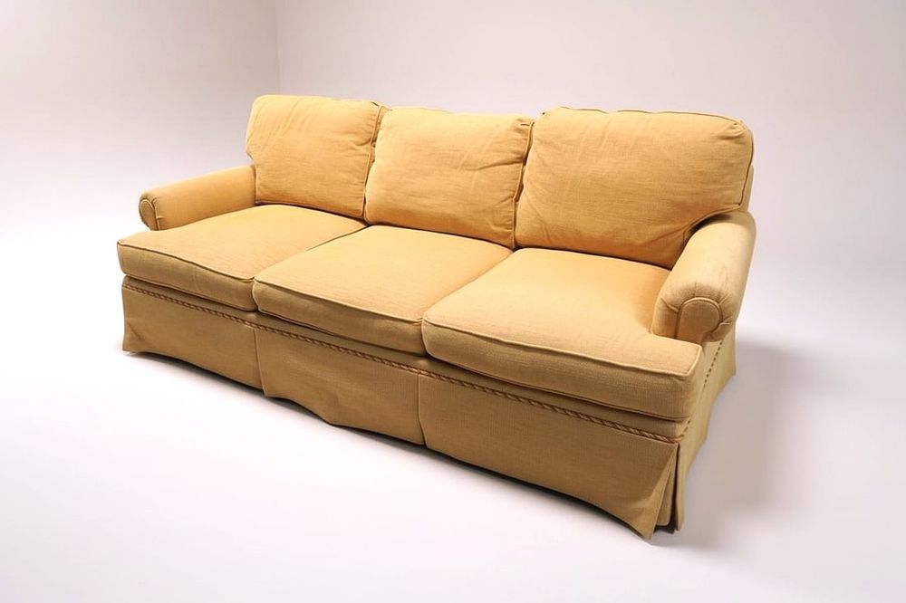 Lot 157: CUSTOM SOUTHWOOD TAN THREE- CUSHION SOFA