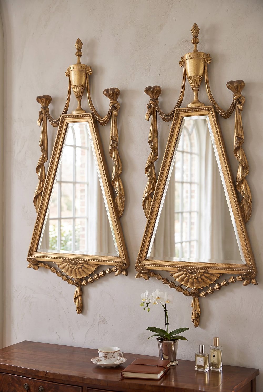 Lot 161: MATCHED PAIR OF CARVED ITALIAN TRIANGULAR MIRRORS