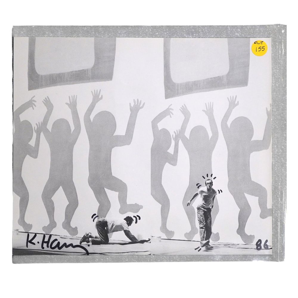 Lot 155: KEITH HARING SIGNED 1986 CATALOGUE PHOTO WITH DRAWN EMBELLISHMENTS