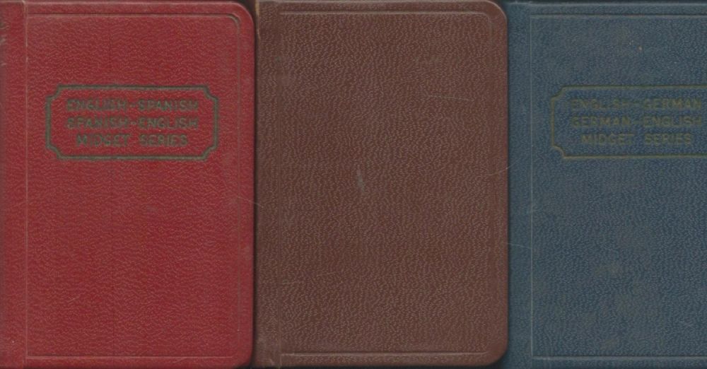 Lot 557: These 3 Midget dictionaries are offered as one...