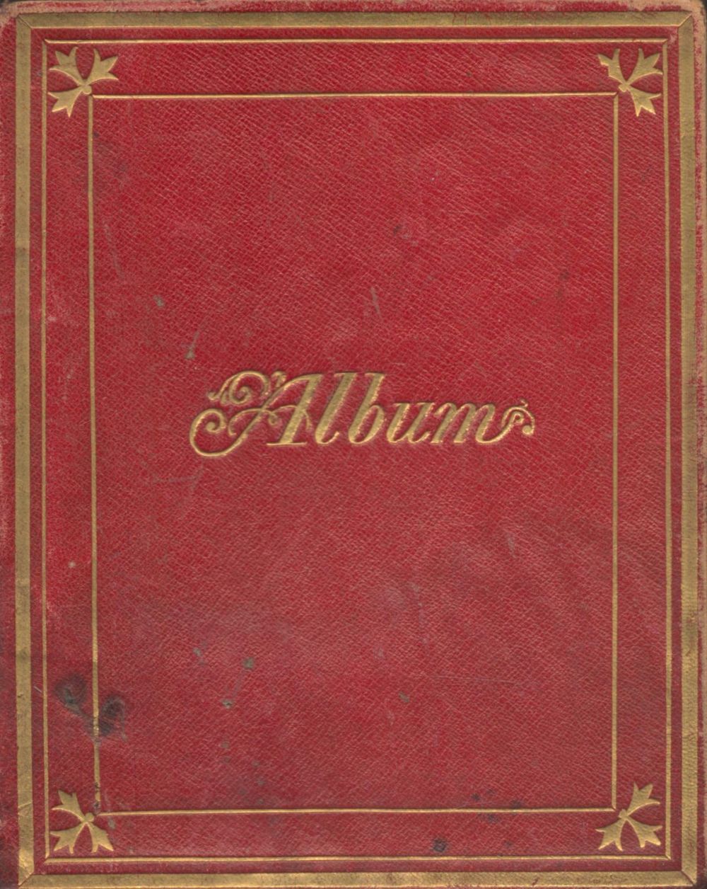 Lot 703: Album commencing 1880 to 1896. Red leatherette, decorated...