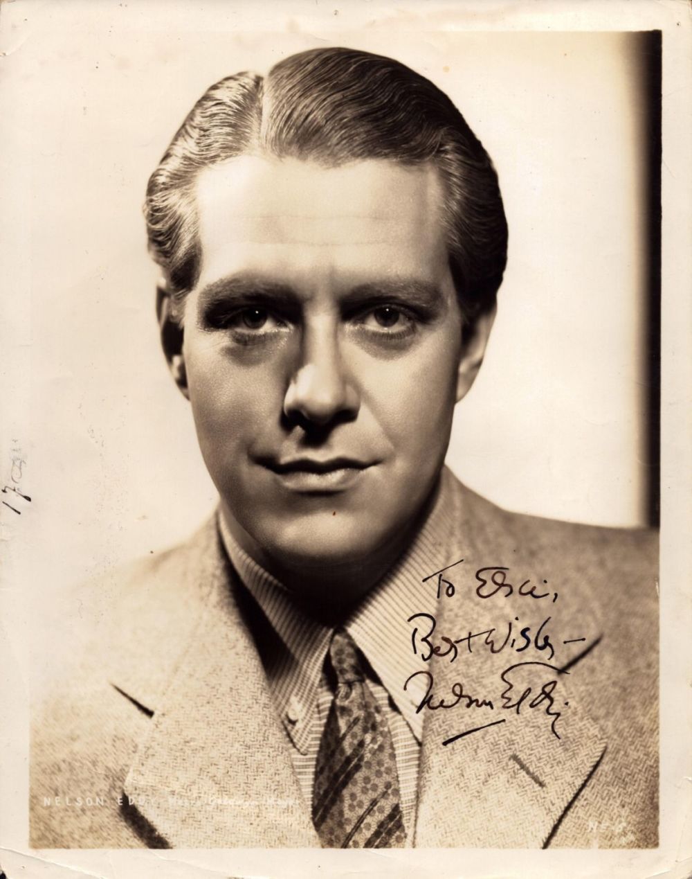 Lot 728: Nelson Eddy signed 10x8 inch vintage sepia photo....