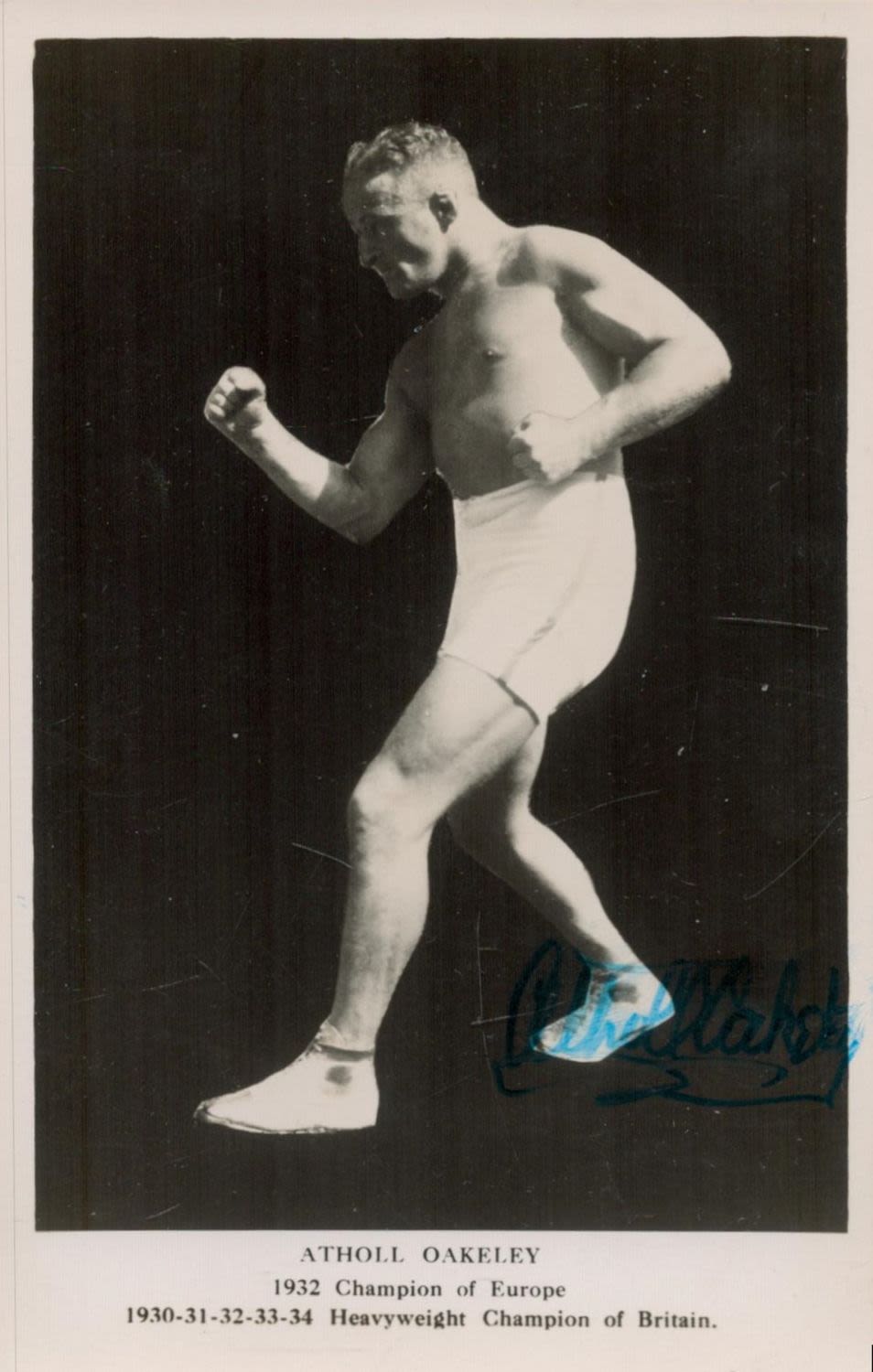 Lot 51: Atholl Oakeley, wrestler. A signed 5.5x3.5 photo postcard...